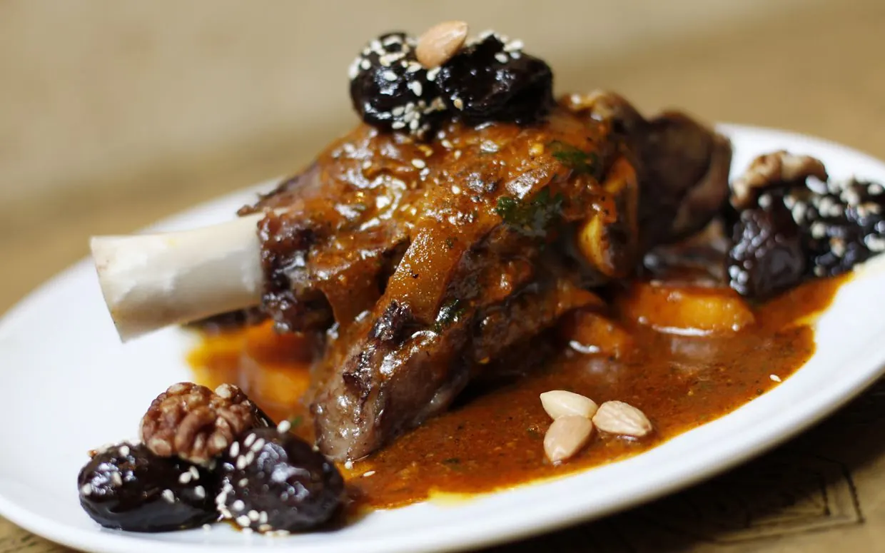 Oven-baked lamb shank with prunes and almonds, one of Dada's signature dishes