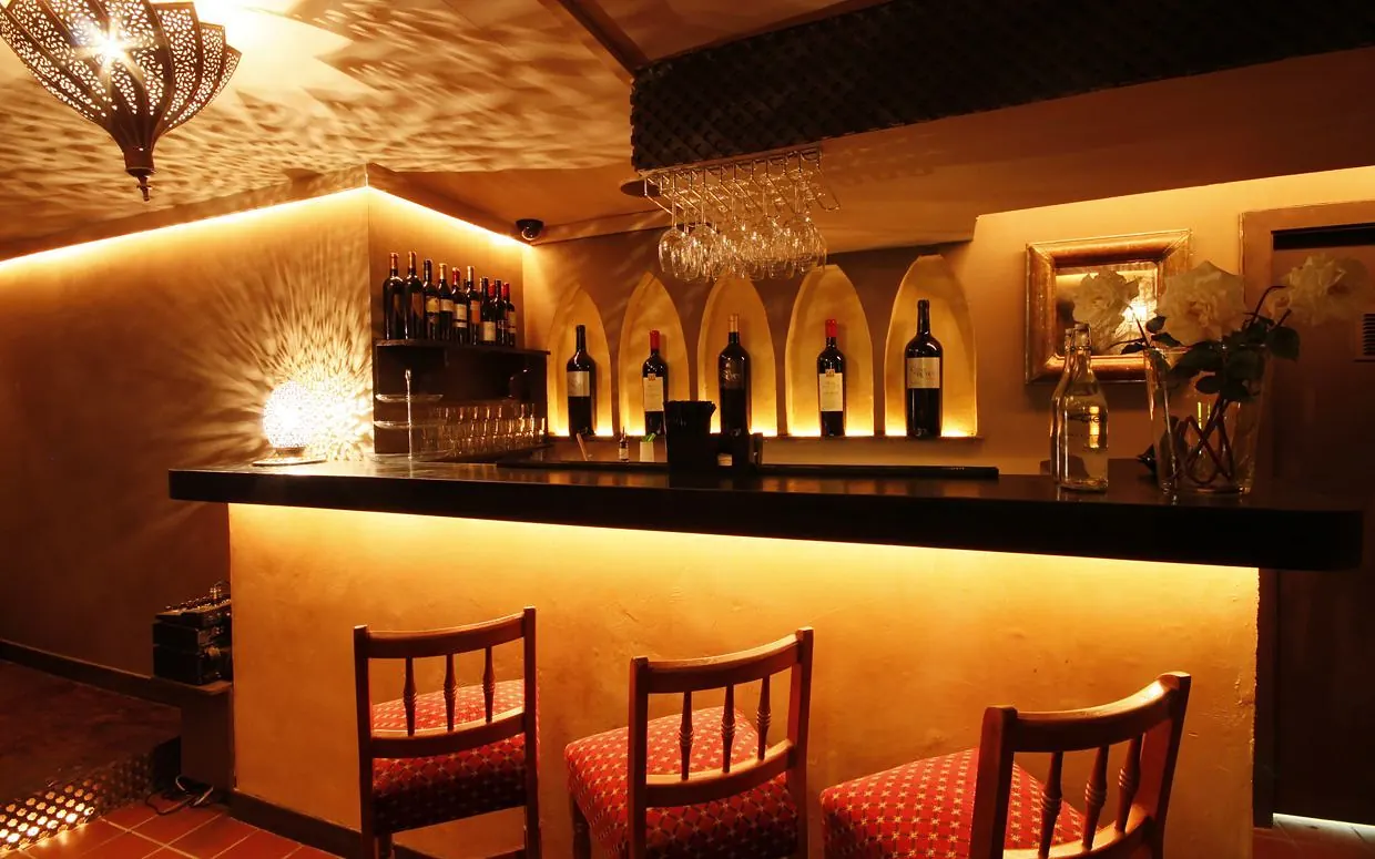 The warmly lit Ziryab Room bar downstairs at Dada